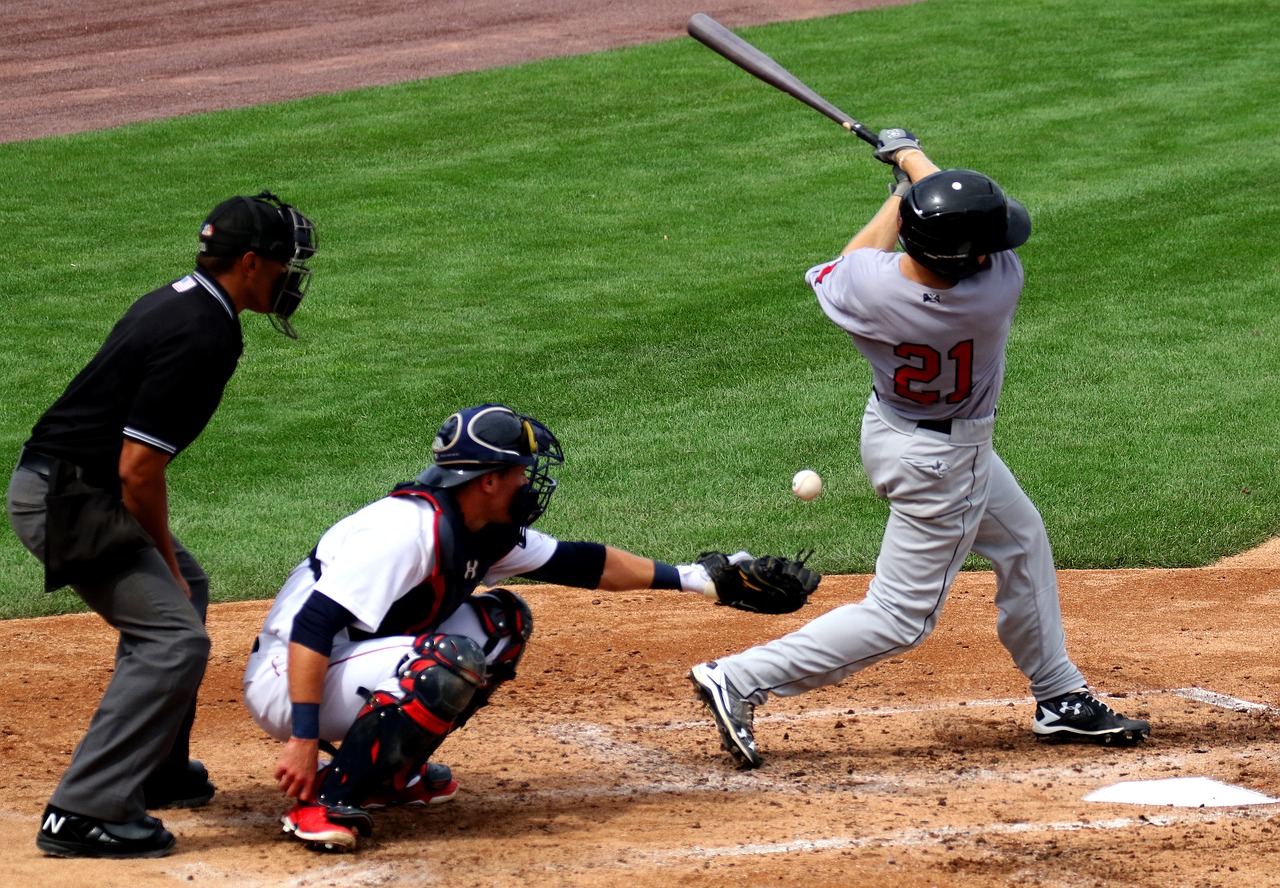 Photo of a baseball batter missing a pitch